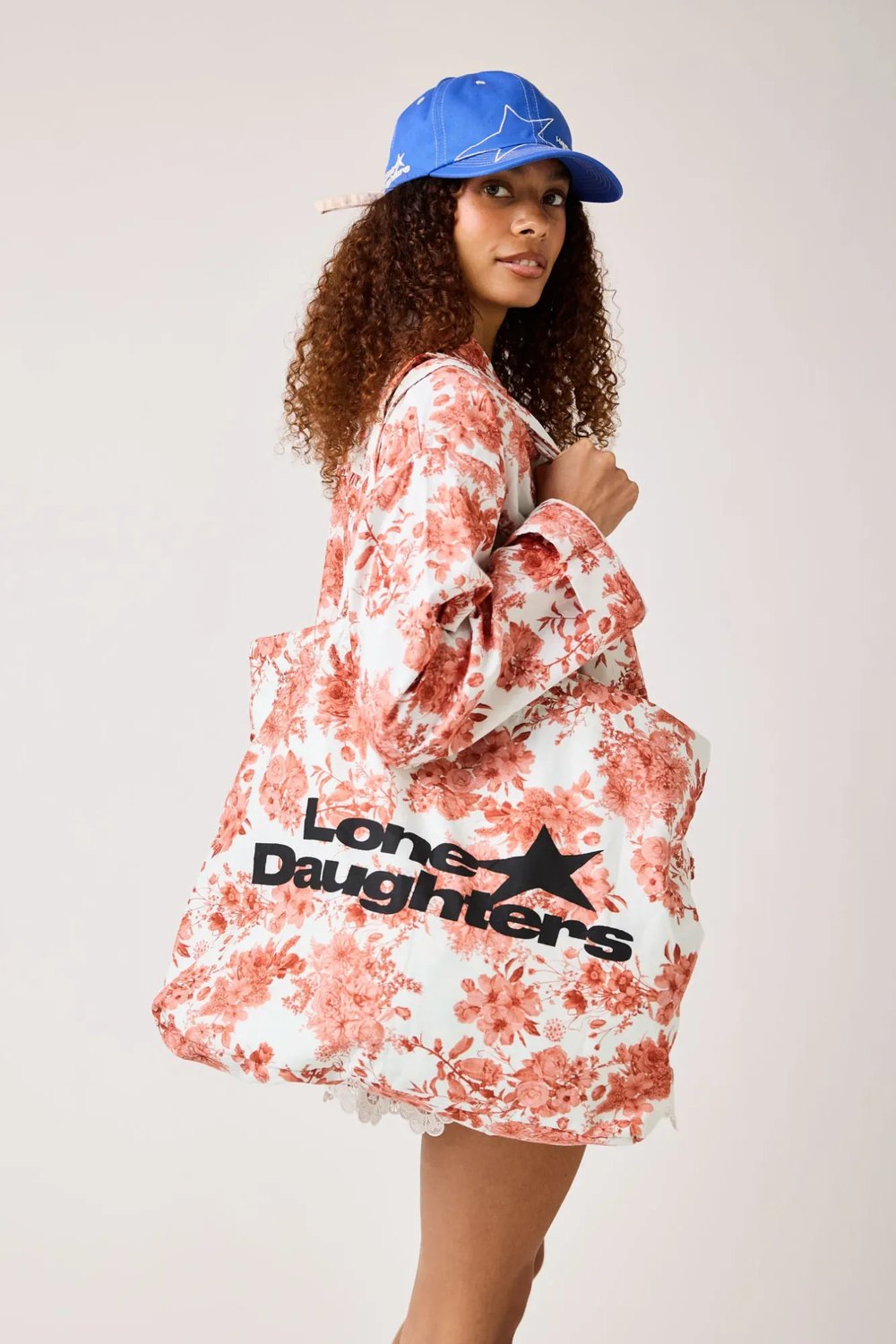 Lonestar Daughters floral shirt with logo tote bag and blue star cap