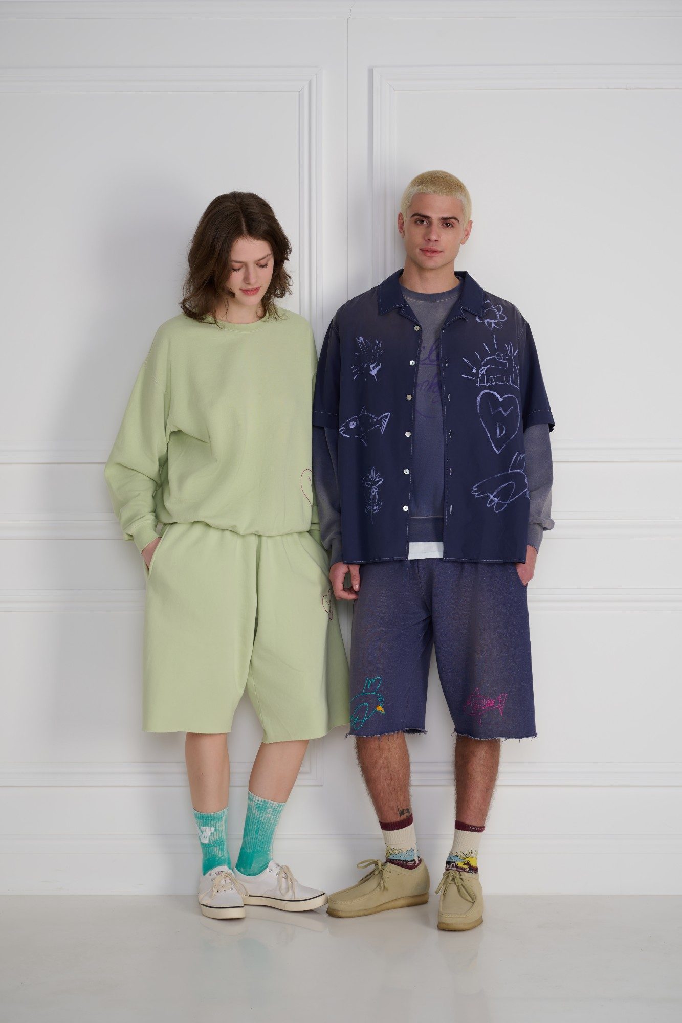 Wild Donkey hand-drawn print shirt and shorts on two models